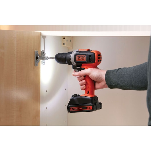 BLACKDECKER BCD703C1 cordless drill with 20V lithium battery used to install cabinet hardware.