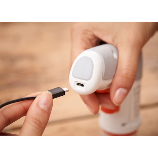 BLACKDECKER BCRTA01 photography of USB charging port and cable close-up on handheld device.