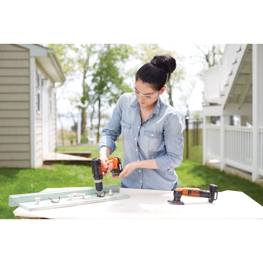 Photo of BLACKDECKER BDCK502C1 power tools used for woodworking on outdoor table.