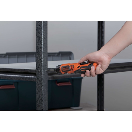 BLACKDECKER BDCS36F cordless screwdriver used to assemble metal shelving, orange and black design.