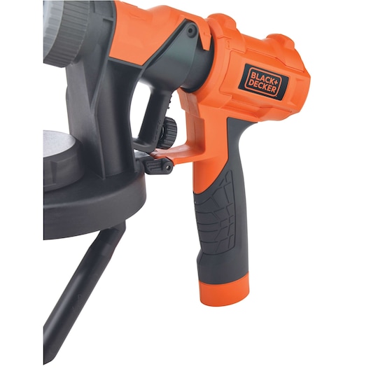 Close-up photo of BLACK+DECKER BDPH1200 spray gun handle in orange and black, product angled on white background.