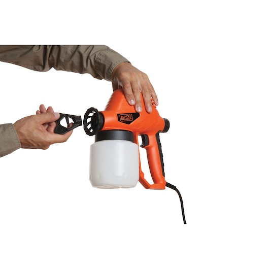 Photo of BLACKDECKER BDPS130 handheld paint sprayer, orange and black, being assembled, white background, front angle.