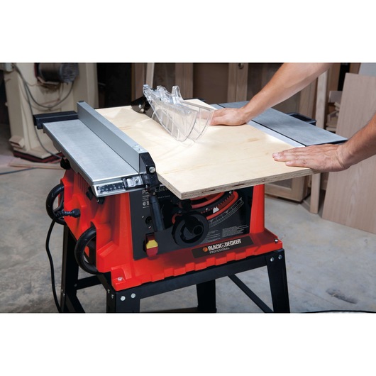 BLACKDECKER BDTS1800 table saw cutting plywood, close-up angle in workshop.