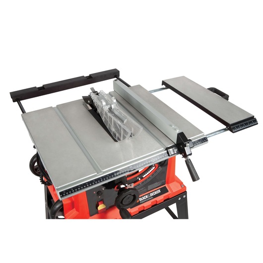 BLACK+DECKER BDTS1800 table saw with silver work surface, blade guard, and black fence, angled top view.