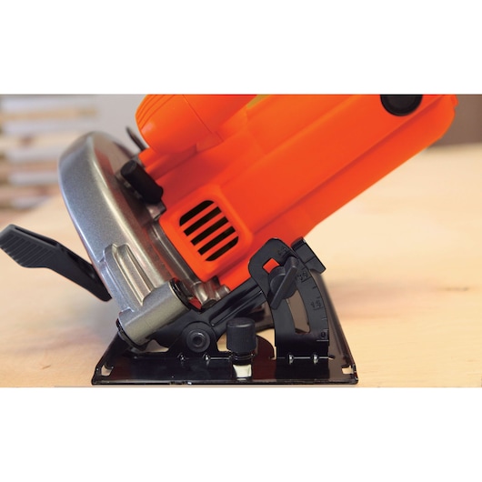 BLACKDECKER CS1004 circular saw side angle showing bevel adjustment and orange housing.