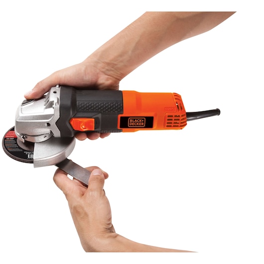 Photo of BLACKDECKER G720 angle grinder in use, black and orange design, close-up on white background.