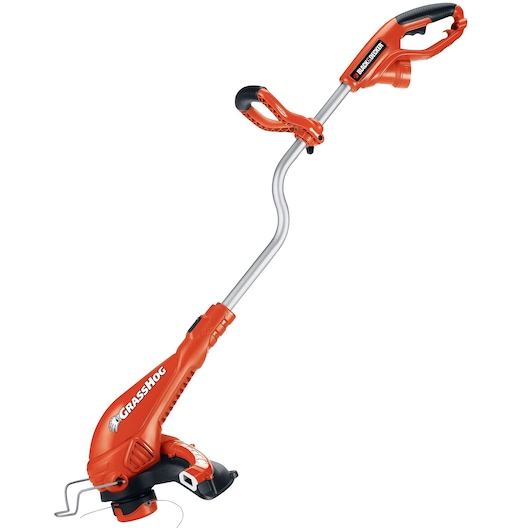 Photo of BLACKDECKER GH750 orange electric string trimmer with curved shaft, side handle, and visible brand logo, side angle.