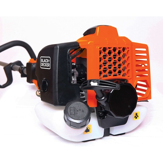 Photo of BLACK+DECKER grass trimmer GST26, close-up angle on orange and black engine with white fuel tank.