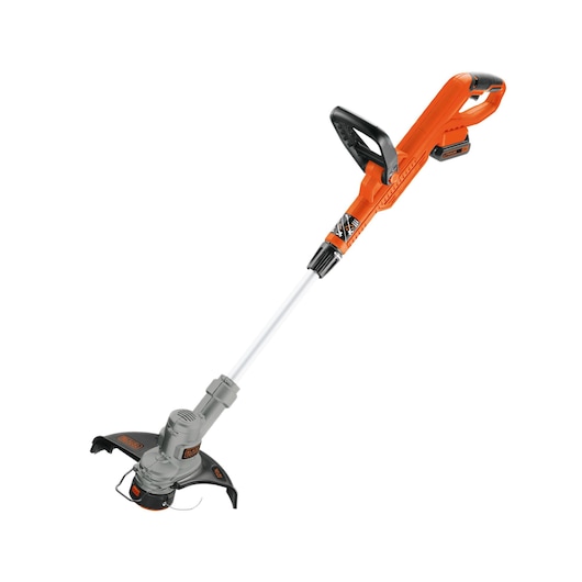 BLACKDECKER LST300 orange and black cordless string trimmer, side angle on white background.